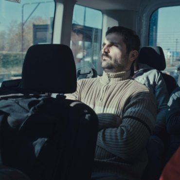 A man seated on a bus